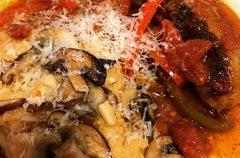 Italian sausage in sweet pepper tomato sauce with sautéed mushrooms & creamy parmesan polenta