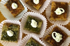 Polenta squares topped with pesto or tapenade